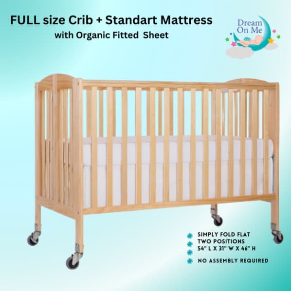 Full-size crib with mattress and fitted sheet