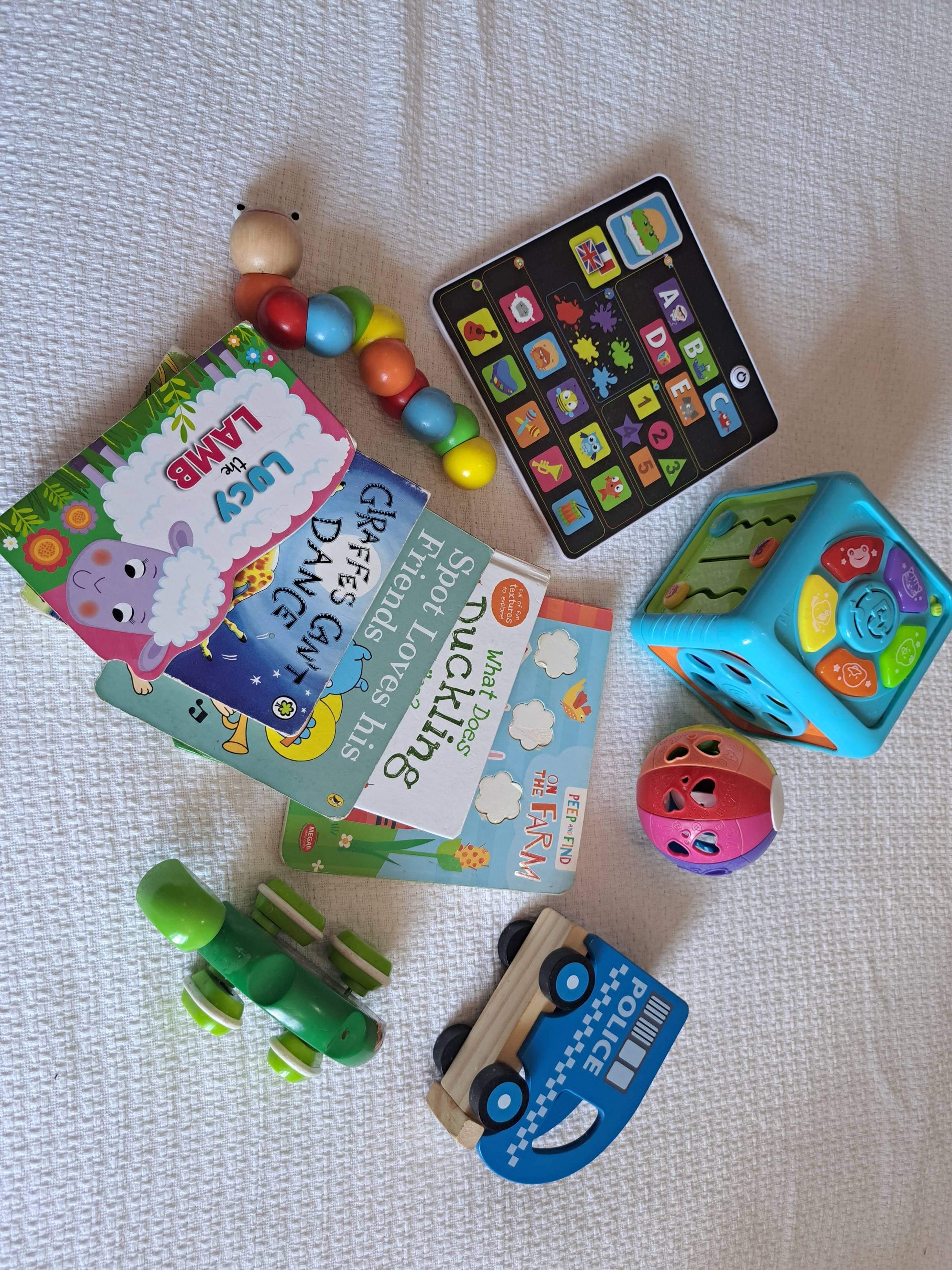 Box of toys and books from 6 months old - 2