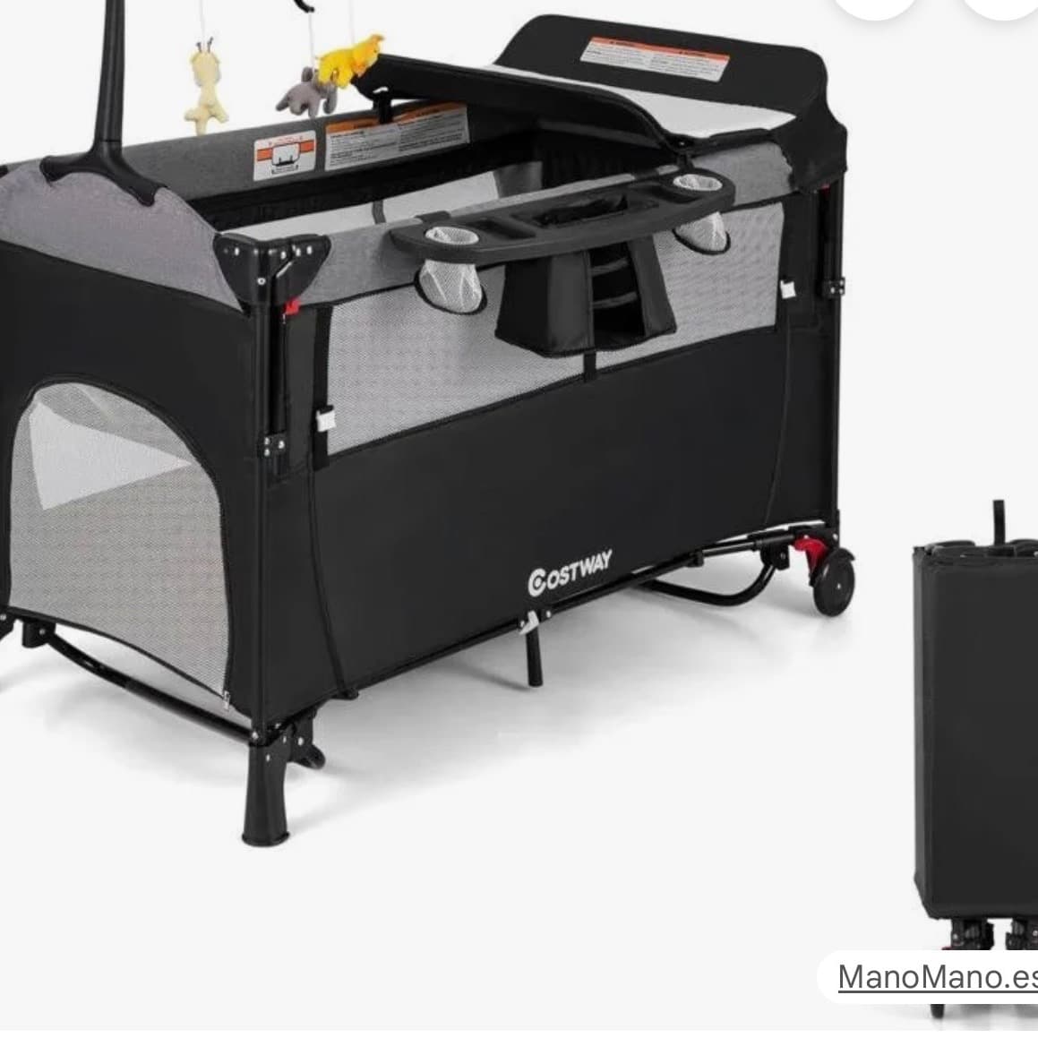 Travel cot with changing table