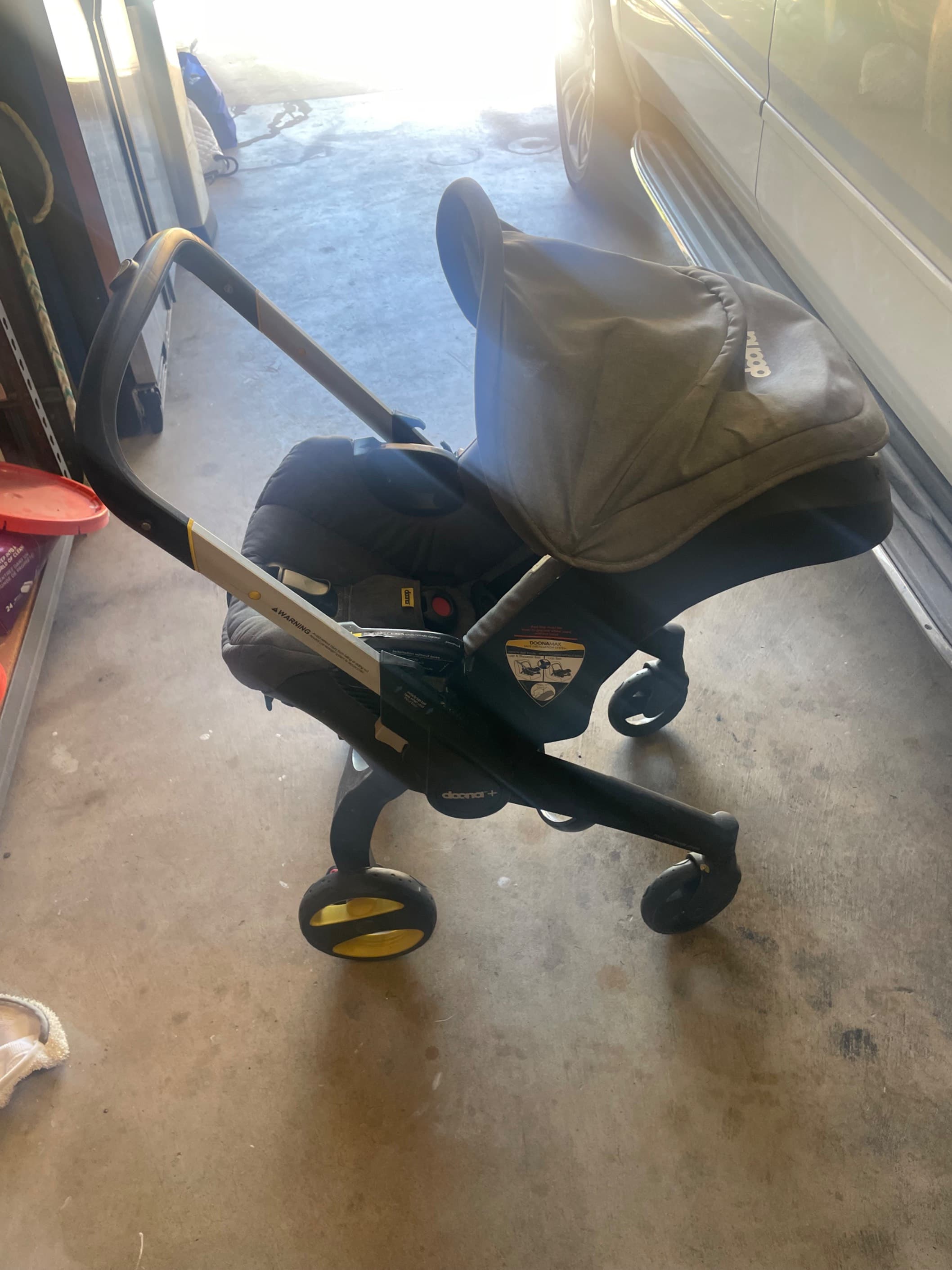 Seggiolino auto e passeggino Doona per neonati - 3